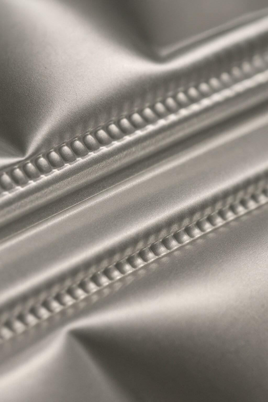 Macro view of aseptic package seals being formed under controlled conditions.